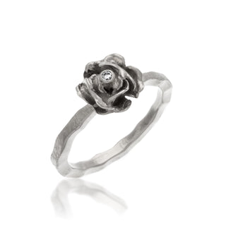 14kt white gold rose set on a 14kt white gold band with a 2pt diamond
