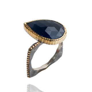 Sapphire pear shaped set in 18k yellow gold. Beaded band, oxidized silver, 14k gold beads.