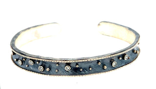Oxidized silver cuff with 14k white gold edges, 6- 2pt diamonds